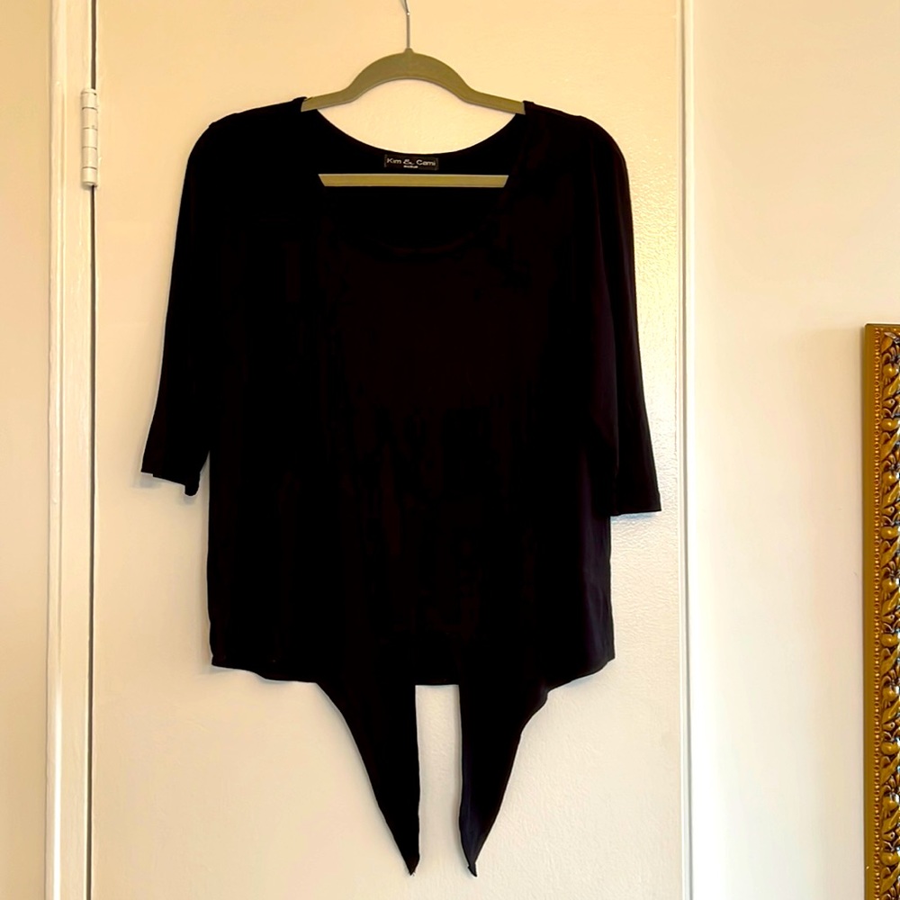 Rayon mix elbow long sleeve black top wit ties in front.  Size M. Like new